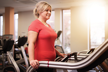 Woman walking on treadmill