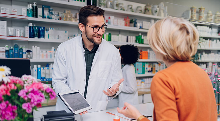 Pharmacist helping customer