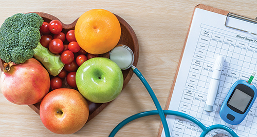 fruit and vegetables next to blood sugar chart